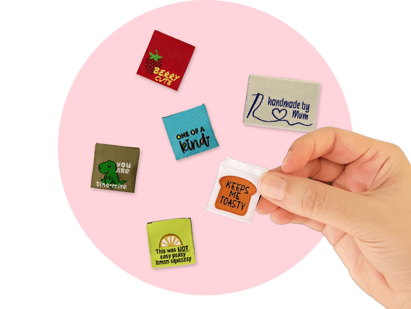 Colorful woven labels in a hand